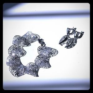 silver bracelet and earnings set